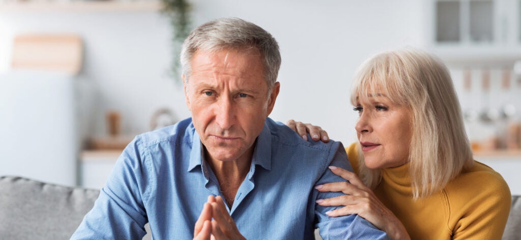 retired couple looking worried
